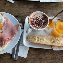 Audacious Breakfast (2 eggs, french bread, croissant, orange juice, hot drink [hot chocolate], and bacon [or ham in my case])