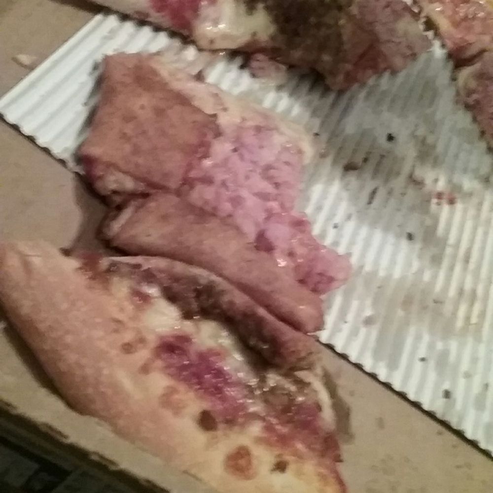 a half eaten pizza in a box a half eaten pizza in a box
