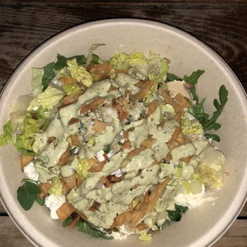 CAVA - Salad base, hummus, crazy feta,braised lamb, shredded romaine, tomato + onion salad, caulifower quinoa tabbouleh, pita crisps, and feta - Mediterranean Near Me - Los Angeles, California