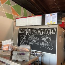 Market on Meadow - Front counter...community and family vibe. Local products displayed all over.