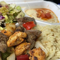 Doner Box - Combo meal. Amazing beef and onions/bell peppers, mildly flavorful chicken, creamy hummus, and pickled salad.