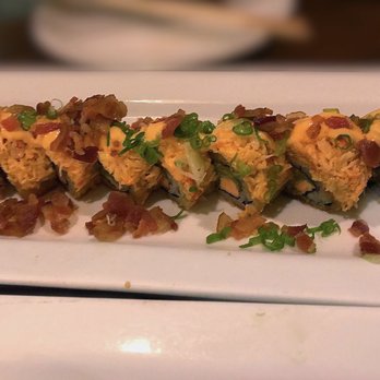 Umi Sake House - Cowboy Roll: salmon, avocado, cream cheese tempura, topped with seared snow crab, bacon bits, green onions with teriyaki & spicy mayo - Sushi Bars Near Me - Seattle, Washington