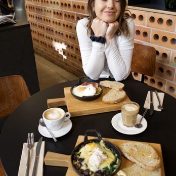 Federal Café - Baked Egg Plates:  Mushroom (bottom in picture) Bacon (top in picture) Coffee: Oat Milk Latte (right) Cappuccino (left) - Breakfast & Brunch Near Me - Barcelona, B