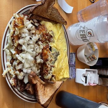 Hungry Peddler - Cheese Omelet with bacon, sausage patty, onion, green pepper, and cheddar cheese. Wheat toast. Hash browns with onions. - American Near Me - La Crosse, Wisconsin Hungry Peddler - Cheese Omelet with bacon, sausage patty, onion, green pepper, and cheddar cheese. Wheat toast. Hash browns with onions. - American Near Me - La Crosse, Wisconsin