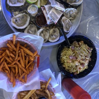 Red Claws Crab Shack - (Clockwise) Combo garlic noodles, parmesan cajun fries, sweet potato fries, and raw oysters. - Cajun/Creole Near Me - Arlington, Texas Red Claws Crab Shack - (Clockwise) Combo garlic noodles, parmesan cajun fries, sweet potato fries, and raw oysters. - Cajun/Creole Near Me - Arlington, Texas