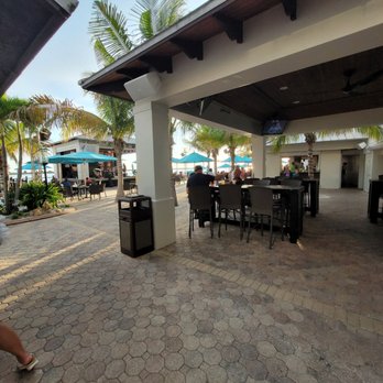 Shephard's Tiki Beach Bar - Lots of seating and band stage. - American Near Me - Clearwater, Florida Shephard's Tiki Beach Bar - Lots of seating and band stage. - American Near Me - Clearwater, Florida