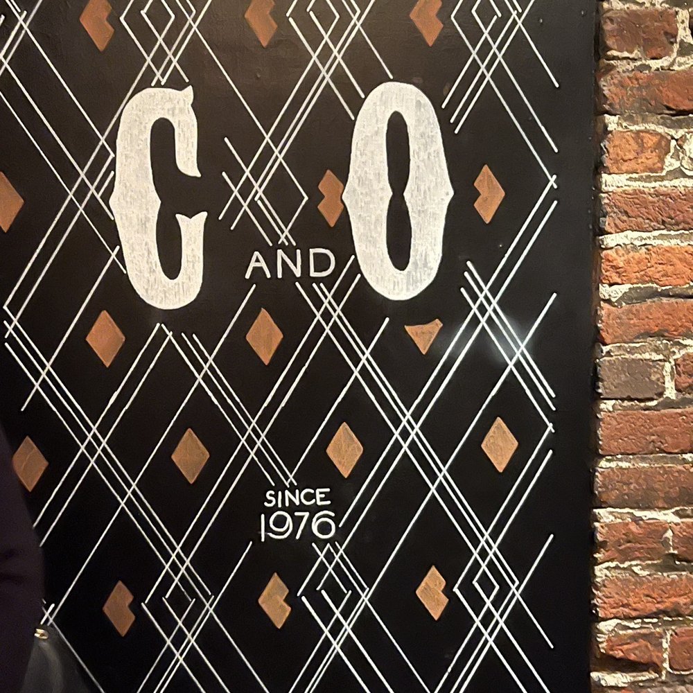 C & O Restaurant - a sign on a brick wall - New American Near Me - Charlottesville, Virginia