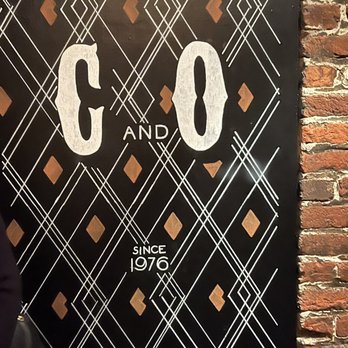 C & O Restaurant - a sign on a brick wall - New American Near Me - Charlottesville, Virginia