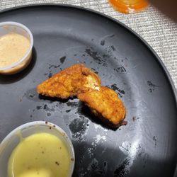 BOSS Tenders, Dogs & Custard - Small hot tender. This was big for the group of 10. Had some as small as a wingstop wing or boneless wing.