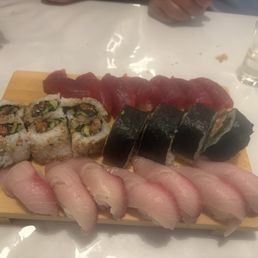 Tuna and Yellowtail nigiri along with assorted rolls