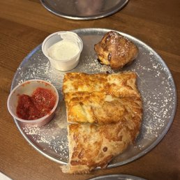 The end of the cheesy bread Ana's buffalo chicken rolls