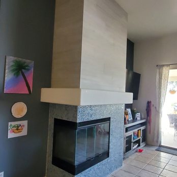 JFM Tile Designs - a fireplace in a living room - Tiling Near Me JFM Tile Designs - a fireplace in a living room - Tiling Near Me