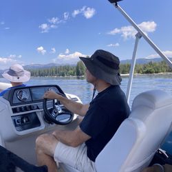 Mountain Meadow Adventure Rentals - Steering the boat