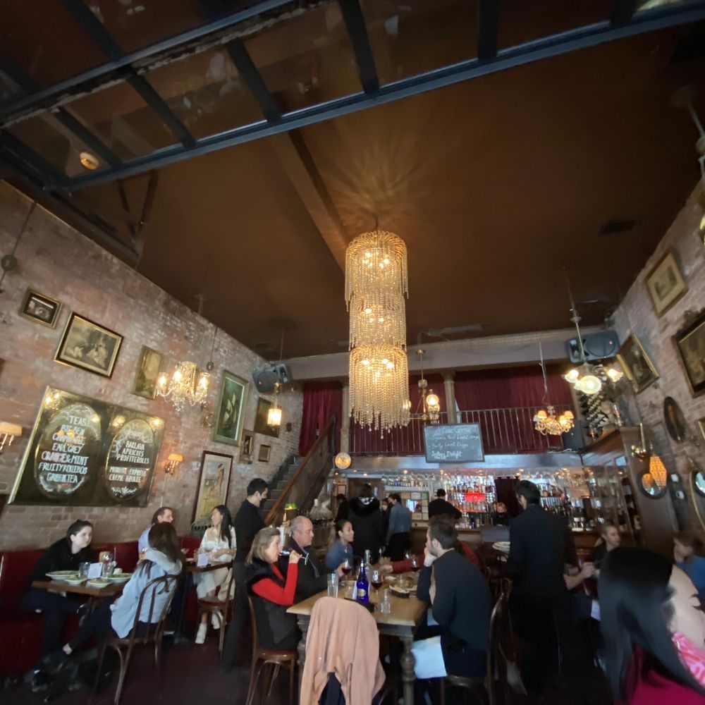 Antique Garage Soho - a restaurant with a chandelier - Mediterranean Near Me - New York, New York Antique Garage Soho - a restaurant with a chandelier - Mediterranean Near Me - New York, New York