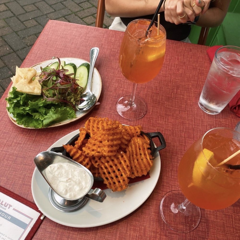 Salut - Sweet potato fries, hummus, and aperol spritz - French Near Me - Edina, Minnesota Salut - Sweet potato fries, hummus, and aperol spritz - French Near Me - Edina, Minnesota