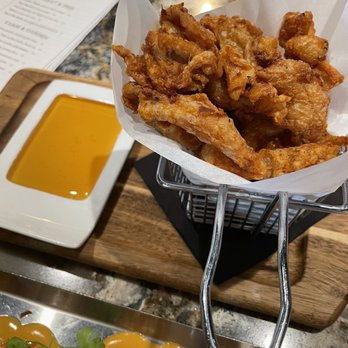 Carson Kitchen - Crispy chicken skin with hot honey dipping sauce. - New American Near Me - Salt Lake City, Utah Carson Kitchen - Crispy chicken skin with hot honey dipping sauce. - New American Near Me - Salt Lake City, Utah
