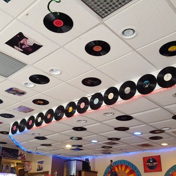 The Cozzy Corner - The walls and ceilings are covered with records by artists from a variety of genre, including r&b, soul, funk, and jazz. - Soul Food Near Me - Appleton, Wisconsin The Cozzy Corner - The walls and ceilings are covered with records by artists from a variety of genre, including r&b, soul, funk, and jazz. - Soul Food Near Me - Appleton, Wisconsin