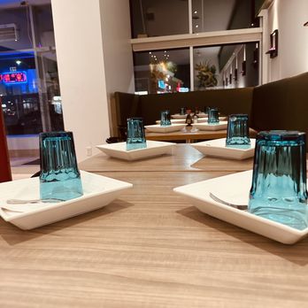 The Hakka Club - a table with four glasses on it - Hakka Near Me - Mississauga, Ontario The Hakka Club - a table with four glasses on it - Hakka Near Me - Mississauga, Ontario