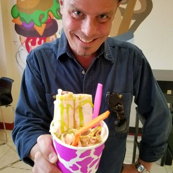 Rolled Ice Cream - Rolls and Grill - Strawberry ice cream with graham cracker sprinkles and key lime drizzle.  Apologies for creepy smile. - Desserts Near Me - Pompano Beach, Florida