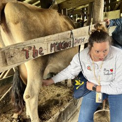 Benton Family Farm - Teacher milking our cow for her class!!!
