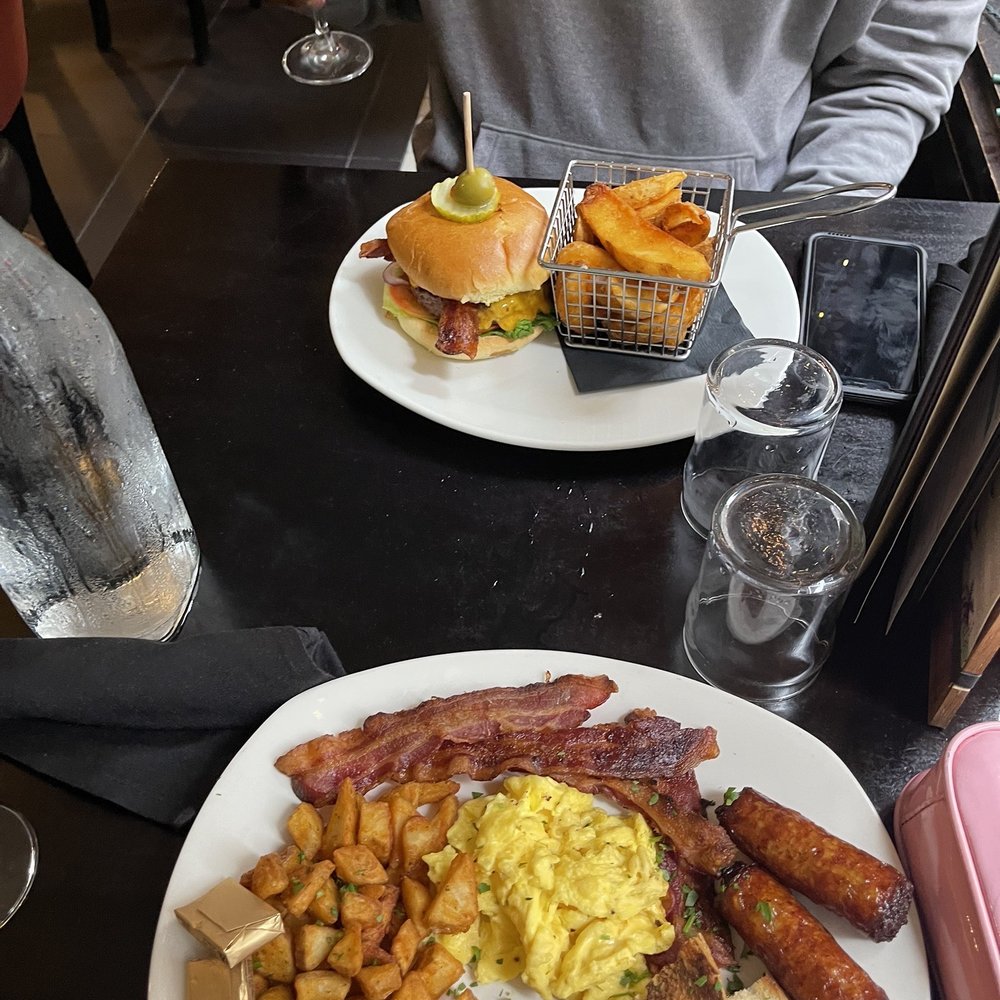 Fado Irish Pub - a man sitting at a table with a plate of food - Irish Near Me - Philadelphia, Pennsylvania Fado Irish Pub - a man sitting at a table with a plate of food - Irish Near Me - Philadelphia, Pennsylvania