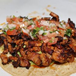 Adolfo's Mexican Food - Pastor Taco ( Marinated Pork with Housemade Guacamole & Housemade Pico de Gallo  in a Large Corn Tortilla.