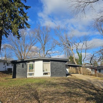 Accurate Tree Service - Evergreen trimmed back 10ft to remove dead branches and vine growth. Branches no longer touching the roof. - Tree Services Near Me - Saint Charles, Missouri