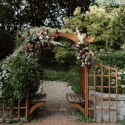 LW Blooms - Beautiful archway decorated with fall florals.