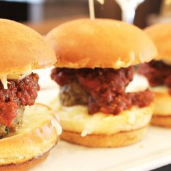 On The Waterfront Restaurant - Albóndigas Mexicanas Sliders - Mexican style meatballs with a savory tomato sauce covered with mozzarella cheese
