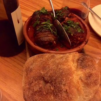 Avec - Chicago - Chorizo-stuffed medjool dates with bacon and piquillo pepper-tomato sauce (and a big hunk of bread for dipping!) - Mediterranean Near Me - Chicago, Illinois Avec - Chicago - Chorizo-stuffed medjool dates with bacon and piquillo pepper-tomato sauce (and a big hunk of bread for dipping!) - Mediterranean Near Me - Chicago, Illinois