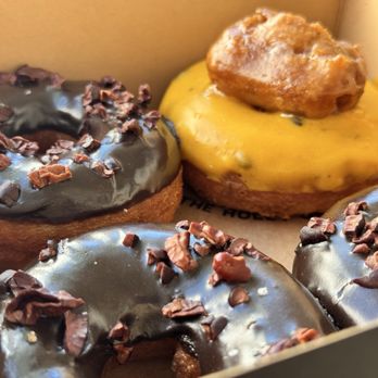 Holey Grail Donuts - Chocolate crunch donuts and one Lilikoi made Holey - Donuts Near Me - Honolulu, Hawaii Holey Grail Donuts - Chocolate crunch donuts and one Lilikoi made Holey - Donuts Near Me - Honolulu, Hawaii