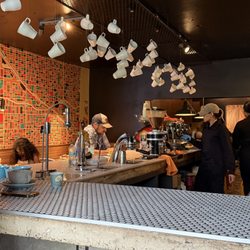 Bistro Cafe - Decor inside. Loved all of the cups hanging! They even have a wall of cups!
