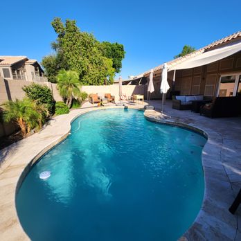 State 48 Pool Cleaning - Resort-style lagoon pool with rock waterfall grotto, kept algae-free and crystal clear. - Pool Cleaners Near Me - Apache Junction, Arizona State 48 Pool Cleaning - Resort-style lagoon pool with rock waterfall grotto, kept algae-free and crystal clear. - Pool Cleaners Near Me - Apache Junction, Arizona