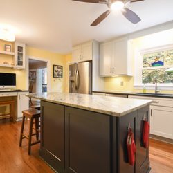 Reico Kitchen & Bath - Merillat Classic cabinets in Tolani door style with Mist & Nightfall finishes and granite countertops in Blue Pearl and Fantasy Blue.