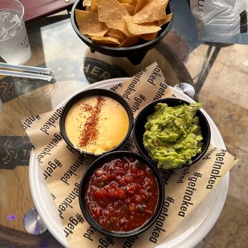 Naked Taco - Trio with chips. Guac, salsa, and queso. - Cocktail Bars Near Me - Miami, Florida Naked Taco - Trio with chips. Guac, salsa, and queso. - Cocktail Bars Near Me - Miami, Florida