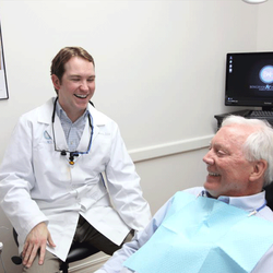 Bingham & Howarth Family Dentistry - Dr. Howarth and a patient laughing