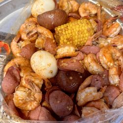 Crafty Crab - 1lb of headless shrimp in garlic butter sauce with sausage & egg