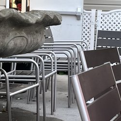 Grotto Pizza - Rehoboth Avenue - Stack of extra chairs they could've used to seat our party of nine without disturbing any other chairs from any other tables.