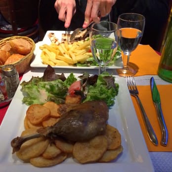 La Rotonde - confit de canard (duck) and chicken escalope in the background - Brasseries Near Me - Paris, 01 La Rotonde - confit de canard (duck) and chicken escalope in the background - Brasseries Near Me - Paris, 01