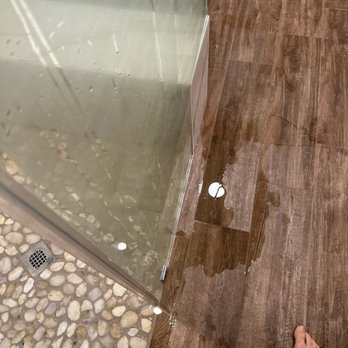 MHC Remodeling Pros - a person standing in a shower - General Contractors Near Me - Magnolia, Texas MHC Remodeling Pros - a person standing in a shower - General Contractors Near Me - Magnolia, Texas