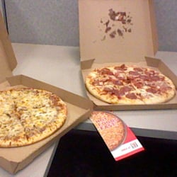 7-Eleven - 2/$10 Pizzas, ready in 90 seconds.
Cheap and fairly decent!
I'll be back!