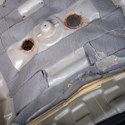 T & W Garage - This is the damage inside the trunk that should have led to a more thorough investigation.