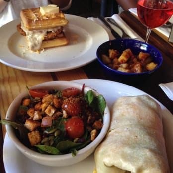 The Hideout Kitchen - Sooooo good! Breakfast Burrito w/ Chicken Apple Sausage, Mixed Greens, Homestyle Potatoes & Honey Fried Chicken waffle! - New American Near Me - Lafayette, California