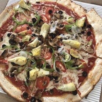 Mario's Pizza - Skimpy cheese. 2 inches of crust. - Pizza Near Me - Union Pier, Michigan