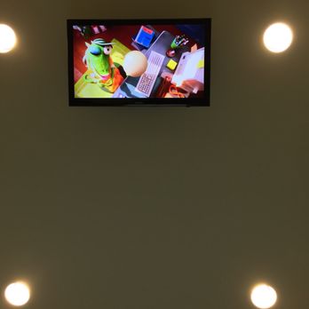 Smith And Bailey Dental - The ceiling-mounted television playing "Sing" through Netflix. - General Dentistry Near Me - Rainbow City, Alabama Smith And Bailey Dental - The ceiling-mounted television playing "Sing" through Netflix. - General Dentistry Near Me - Rainbow City, Alabama