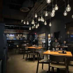Gravity Taphouse Grille - Dining area looking toward entrance and bar area.