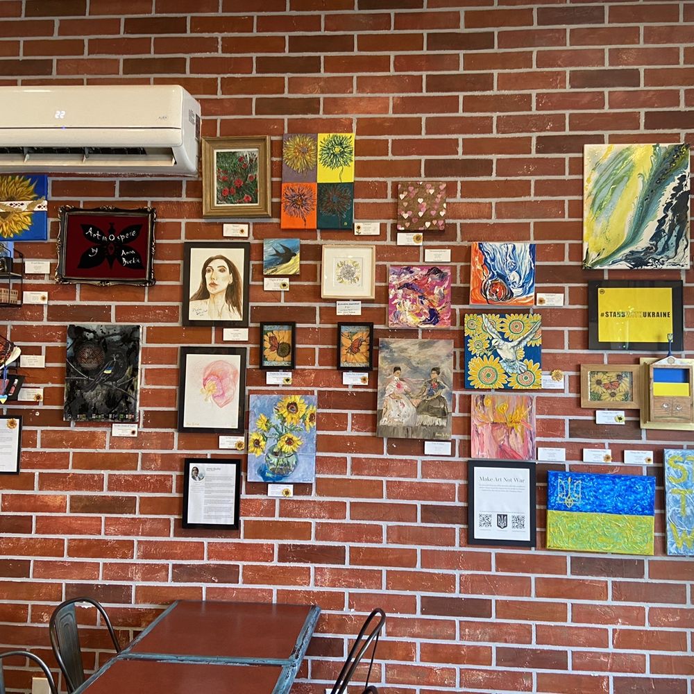 Cafe Amor & Art - a brick wall covered in art - Cafes Near Me - Windsor, Ontario Cafe Amor & Art - a brick wall covered in art - Cafes Near Me - Windsor, Ontario