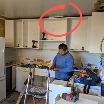 Eat Gather Love - Despite the installers saying they didn't "see" the lamp so they could remove it, this photo shows above the cabinets. - Kitchen & Bath Near Me - San Diego, California Eat Gather Love - Despite the installers saying they didn't "see" the lamp so they could remove it, this photo shows above the cabinets. - Kitchen & Bath Near Me - San Diego, California