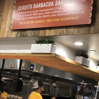 Chicken + Whiskey - Despite the sign, this is not a "BIG" sandwich. At all. - Venezuelan Near Me - Washington, DC, District of Columbia