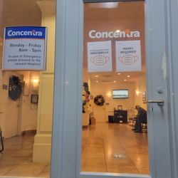 Concentra - 1. Empty waiting room, but forced to sit outside..  2. Sign says "masks required," but they refuse to give you any.